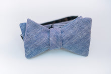 A two-toned herringbone linen bow tie with blue and white hues on this mid-weight bow tie.   Imported from Ireland.  100% Linen  Height: 3" x Width: 4.25" x Knot Size: .75 (Approx.)  Dry Clean Only