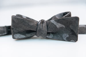 A black & grey Camouflage Cotton Bow Tie.  Height: 3” x Width: 4.5"   Knot Size: .75”  (Approx.)  Dry Clean Only
