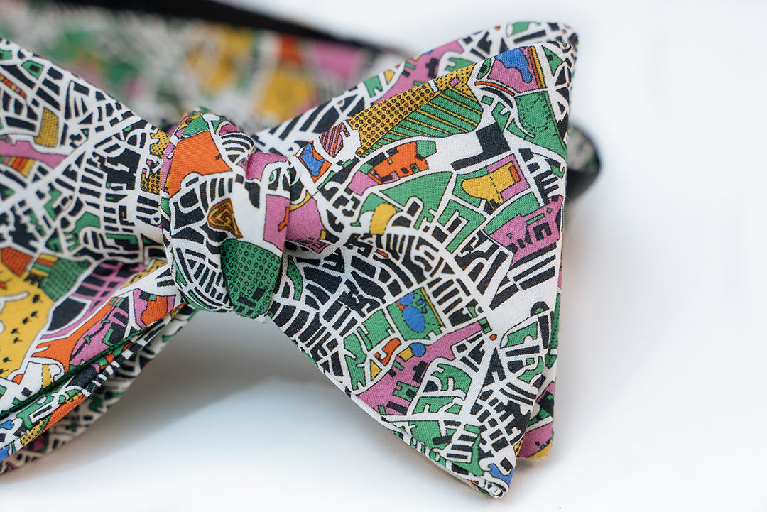 Enjoy an artist's interpretation of what London looks like from a bird side view. Abstract and playful is what you will get from this design.  You will get a full range of colors from the green and yellow fields to the blue body of waters. It even has some pastel pinks and orange abstract from the building designs.   No bow tie is guaranteed on pattern placement as each bow tie will vary slightly.   Height: 3