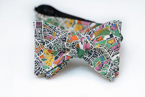 Enjoy an artist's interpretation of what London looks like from a bird side view. Abstract and playful is what you will get from this design.  You will get a full range of colors from the green and yellow fields to the blue body of waters. It even has some pastel pinks and orange abstract from the building designs.   No bow tie is guaranteed on pattern placement as each bow tie will vary slightly.   Height: 3" x Width: 4.25" x Knot Size: .75  (Approx.)  Dry Clean Only