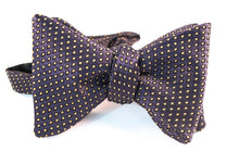 A gorgeous navy & mustard jacquard with woven polka dots dancing on elegant evening bow tie.   Height: 3” x Width: 4.5"   Knot Size: .75”  (Approx.)  Dry Clean Only